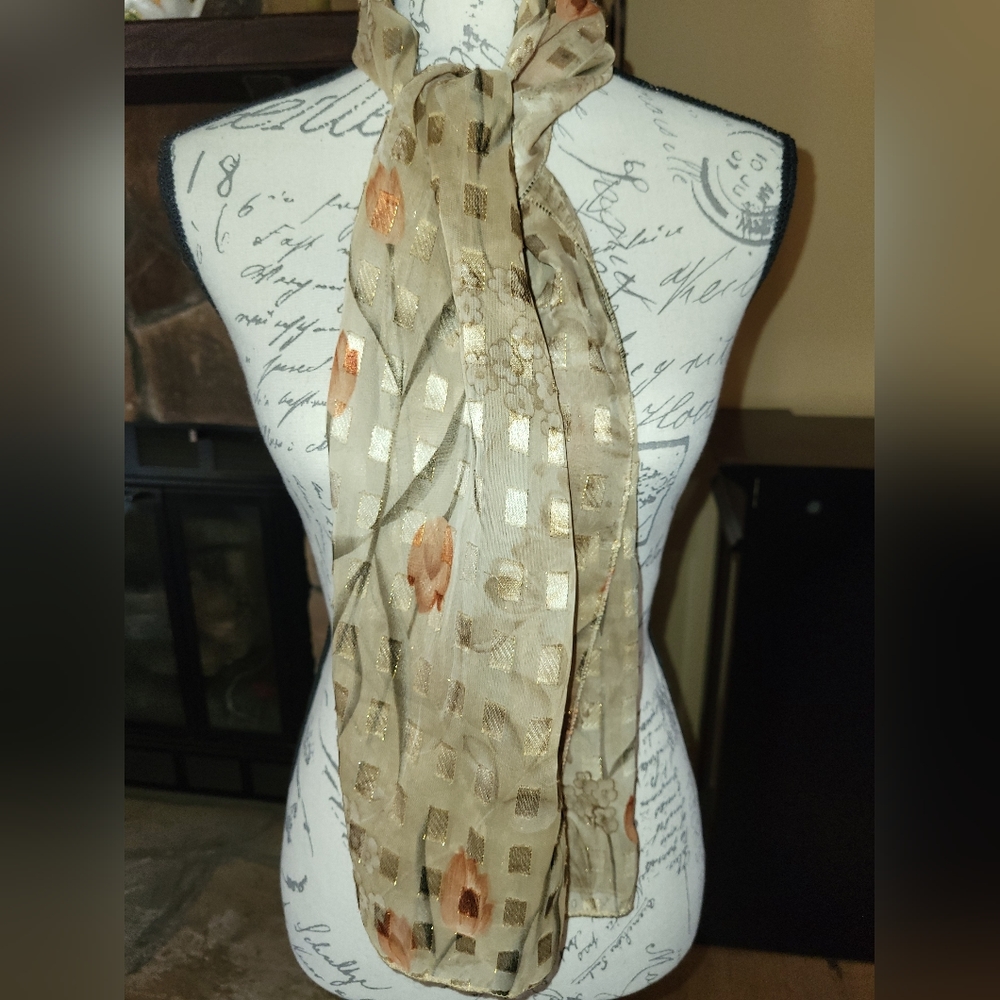 Silk scarf. Gold with minimal floral and gold thread accents.